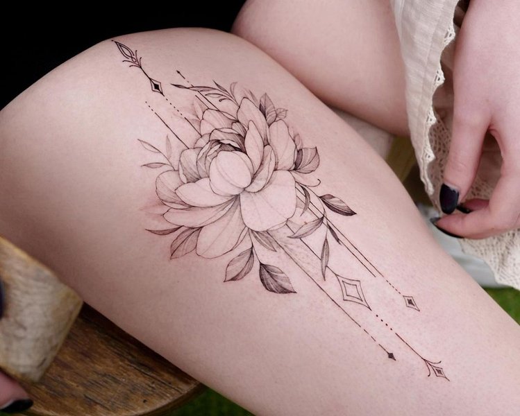 Women Embrace The Thigh Tattoo Craze